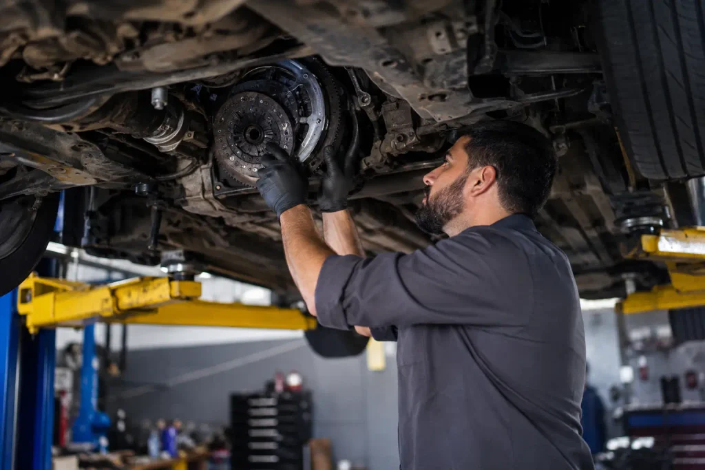 Professional technician checking the transmission and clutch system of a manual car in Murfreesboro